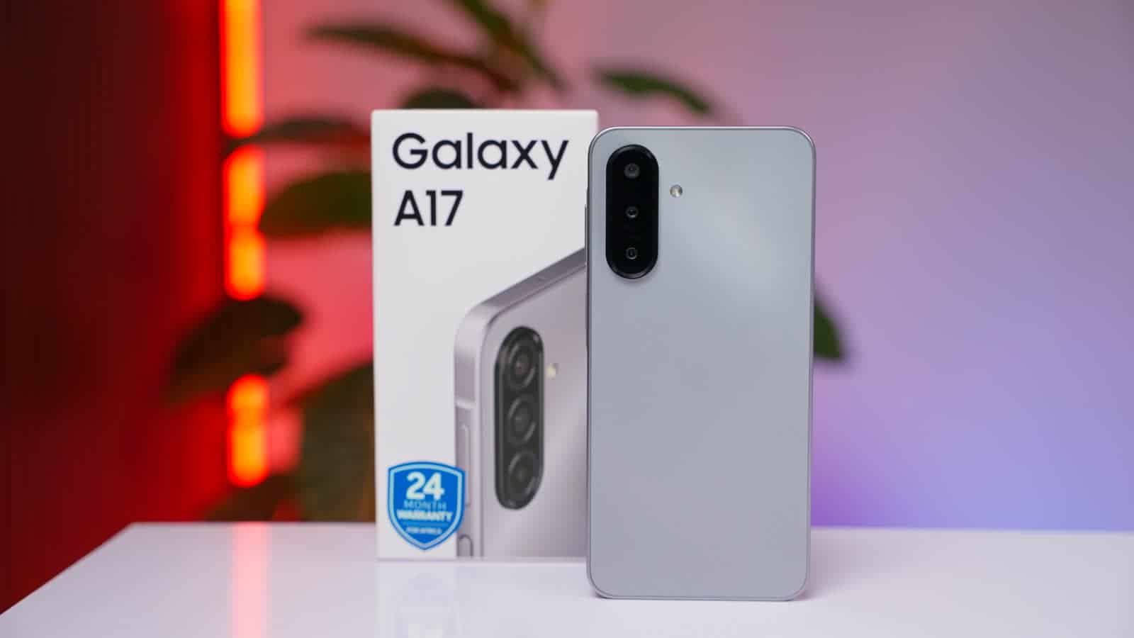 The Samsung Galaxy A17 in grey standing in front of its box