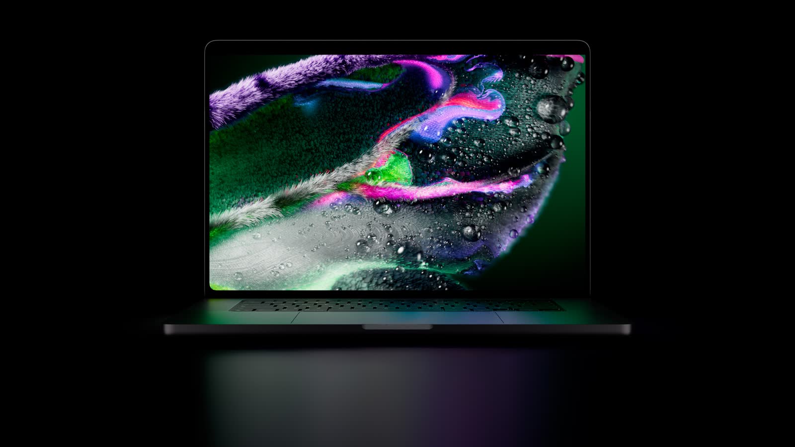 The MacBook Pro with PROLED XDR Display seen from the front, open, against a black background